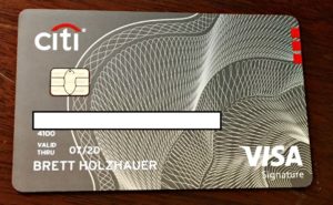 a credit card with a white and grey design