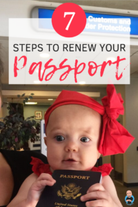 a baby with a red bow on her head