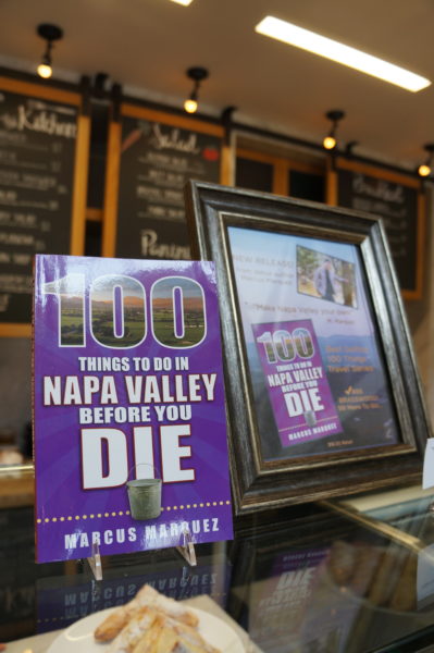 a purple sign next to a picture frame
