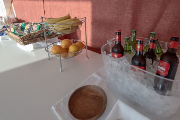 a table with fruit and bottles on it