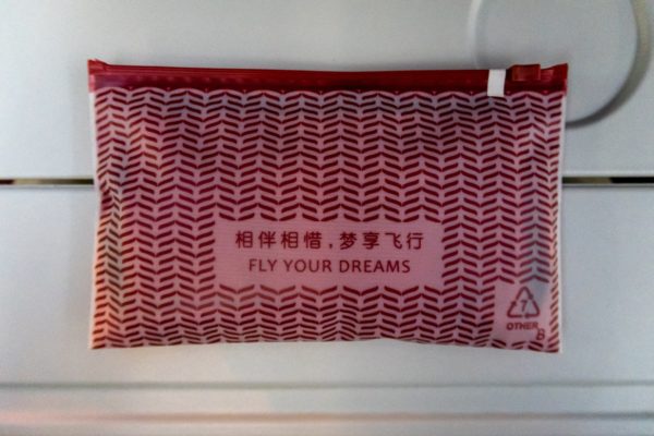 a red and white bag with text on it