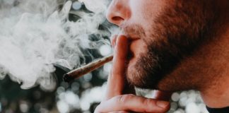Man smoking marijuana by Elsa Olofsson on Unsplash