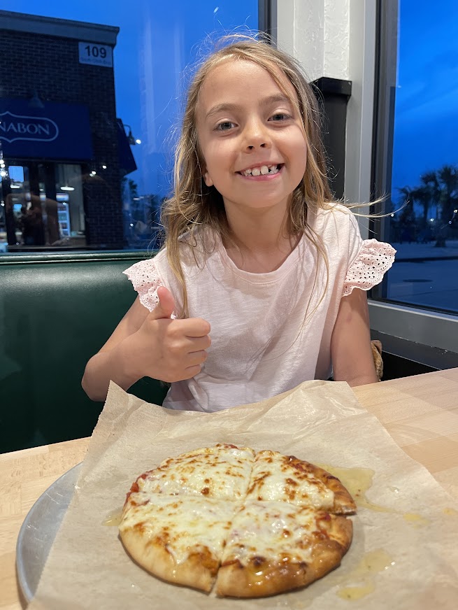 Valerio’s Pizza & Italian at Downtown OWA - May 2023 - Scarlett happy with cheese pizza