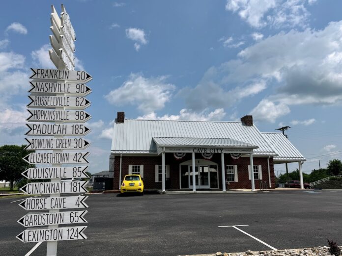 Visit Cave City building with city signs